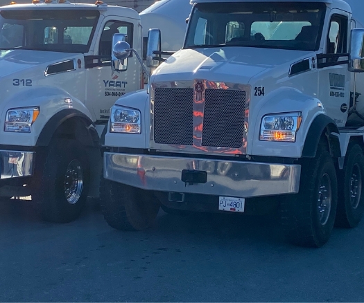 Concrete trucks from Vancouver Ready Mix and YAAT parked and ready for dispatch